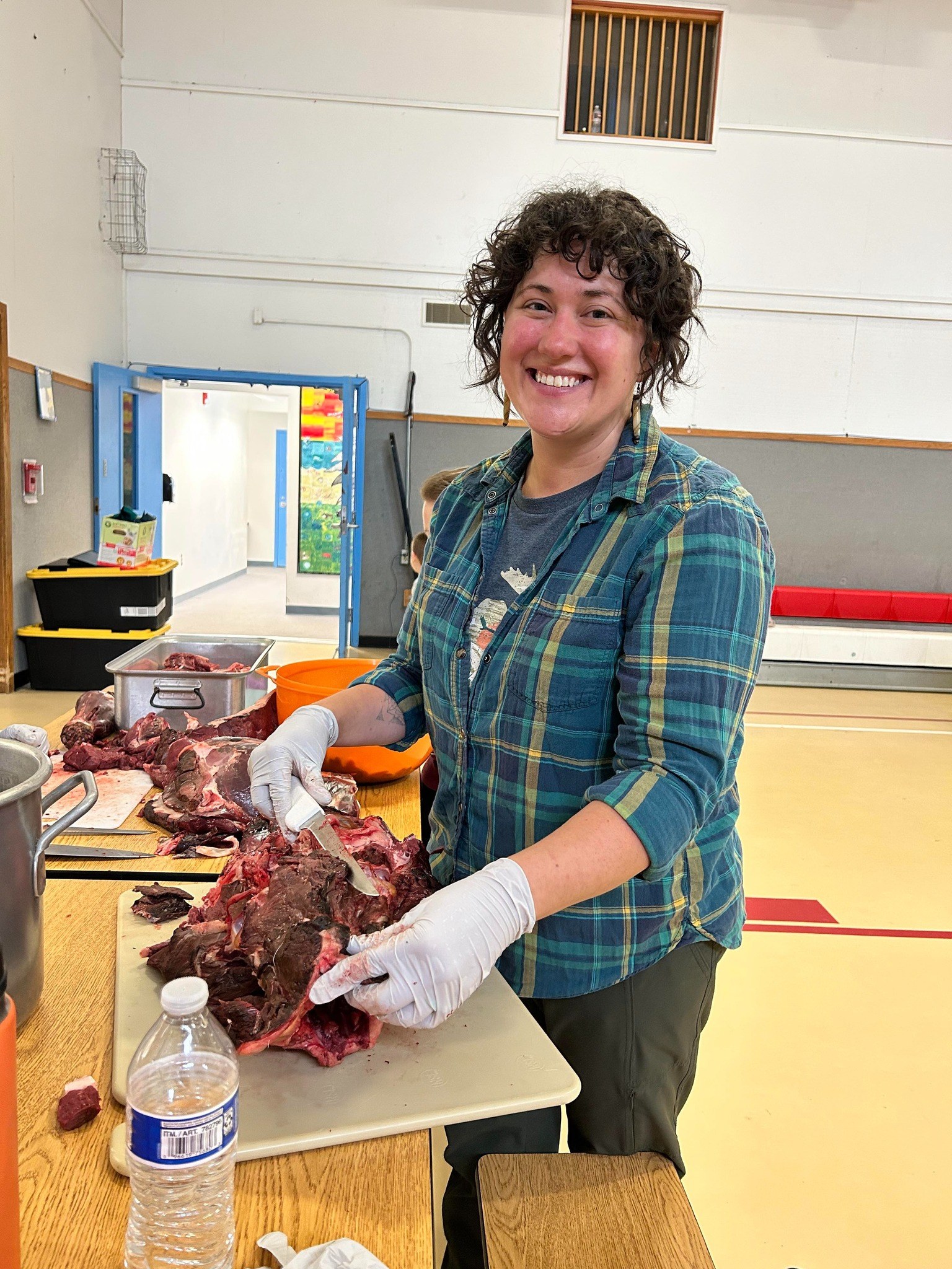 Julie processing caribou at Port Heiden.